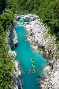 Kayaking on Soca river in Slovenia